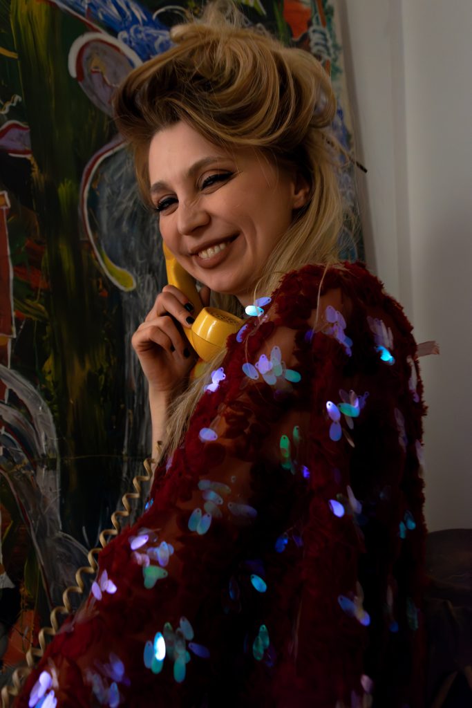 Justyna Sekmistrz smiling in a crimson sequin kimono by Rai Kimonos